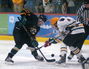 St. Mary, left, and Taconic, right, face off in a high school hockey team Friday night at Amelia Park Ice Arena. (Photo by Chris Putz)