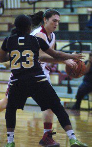 Westfield's Karly Mastello tries to drive past Central's Alayah Sweeney Friday night in a high school girls' basketball opener. (Photo by Chris Putz)