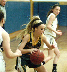 Southwick's Taylor Leclair dribbles the ball out of traffic Friday night at St. Joe's in Pittsfield. (Photo by Chris Putz)