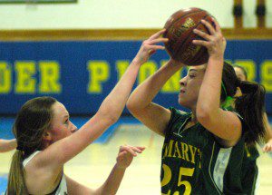 St. Mary's Francesca DePergola (25) plays keep away with a Pathfinder Pioneer. (Photo by Chris Putz)