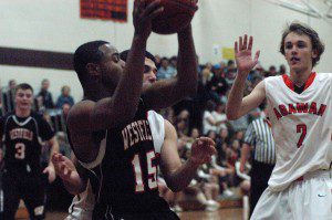 Bombers' Isaiah Headley (15) looks to make a move in the low post. (Photo by Chris Putz)