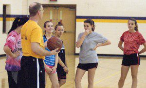 Westfield Voc-Tech girls' basketball coach Matt Seklecki delivers instructions to his players at practice Wednesday. The Tigers regained status as a varsity team after one year as a JV-only unit. (Photo by Chris Putz)