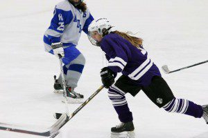 Cathedral's Madison Pelletier, of Westfield splits the defense against Auburn in a girls' ice hockey game Saturday at Cyr Arena. (Submitted photo) 