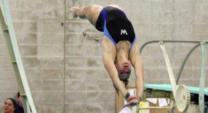 Katie Sterpka reaches back for the water during the 3-meter diving. (Gary Robinson/UMD photo)