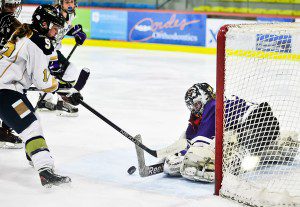Cathedral goalkeeper Lexi Levere, right, makes the save against Shrewsbury's Megan Moran during a 2015 game at Amelia Park Ice Arena. (Photo by Frederick Gore)
