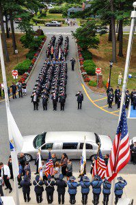 The family of Westfield police officer Jose Torres arrives at Westfield State University during his funeral procession in 2012. (File photo by Frederick Gore)