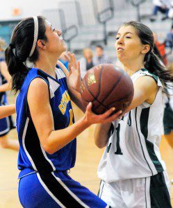 St. Mary's Elisa Kosinski, right, attempts to block Gateway's Alyssa Moreau during the second quarter of Tuesday night's game. (Photo by Frederick Gore)