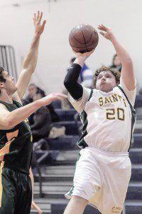 St. Mary's Jacob Butler, right, looks for the net during Wednesday night's game against Holyoke Catholic. (Photo by Frederick Gore) 