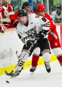 Westfield senior forward Connor Sullivan takes control during the first period of Friday night's game against East Longmeadow. (Photo by Frederick Gore)