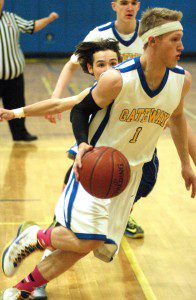 Gateway's Johnny Haskell (1) looks to turn the corner as he drives toward the hoop. (Photo by Chris Putz)