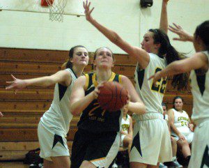 Southwick's McKinley White (24) splits the Holyoke Catholic defense Friday night. (Photo by Chris Putz)