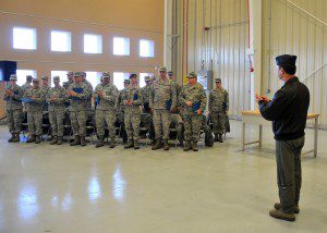 Lt. Col. Kenneth Lambrich congratulates 25 members of the 104th Fighter Wing  Massachusetts Air National Guard who graduated from the Community College of  the Air Force. The members were awarded their various degrees during the  ceremony at Barnes Air National Guard Base. (U.S. Air National Guard photo by Master Sgt. Mark W.  Fortin/Released) 