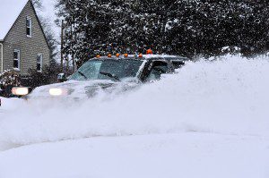 An independent plow contractor clears a side street in Southwick as Winter Storm Linus roared through the area yesterday. (Photo by Frederick Gore)