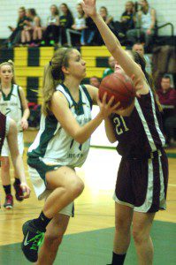 Southwick's Morgan Harriman attempts to lay up the ball against Easthampton Friday night. (Photo by Chris Putz)