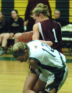 The Rams attempt to wrestle the ball away from Easthampton in a high school girls' basketball game Friday night in Southwick. (Photo by Chris Putz) 