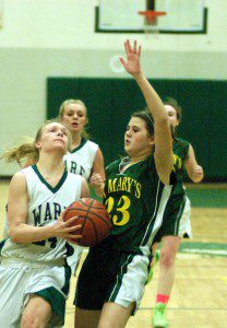 St. Mary's Allissa Easton (23) defends the ball against Ware Tuesday. (Photo by Chris Putz