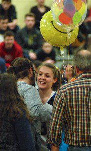 Gateway senior Caroline Booth gets an emotional reception on senior night Wednesday. (Photo by Chris Putz)