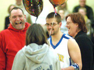 Gateway senior boys' basketball player Tyler Kornacki is joined by family and friends at half court as part of the senior night pregame ceremony Thursday night in Huntington. (Photo by Chris Putz)