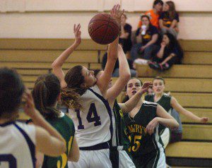 Voc-Tech's Heather Lannon (14) takes a backward glance at the ball as the Tigers and St. Mary's Saints battled Thursday night. (Photo by Chris Putz)