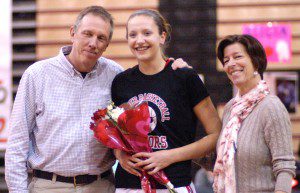 Westfield High School girls' basketball senior Alicia Arnold joins family members for a snapshot on senior night Monday. (Photo by Chris Putz)