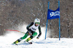 Westfield No. 1 Junior Neil Sheehan shoots past a giant slalom gate in Tuesday's Western Mass Individual race. (Photo by Liam Sheehan)