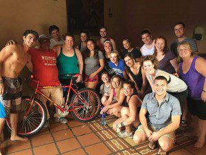 Westfield State students pose with Mario, a Nicaraguan worker, as they present him his new bike. (Photo submitted)