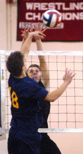 Westfield's Eric Shilyuk, right, battles a Putnam player at the net earlier this season. Shilyuk and the Bombers extended their win streak to seven straight games Wednesday. (Photo by Chris Putz)