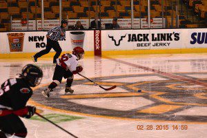 Francis Powers on a breakaway through the Bruins logo at center ice. (Photo submitted) 