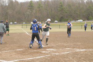 Gateway catcher Dayna Britlant waits for the ball as Southwick's Tori DellaGiustina scores during Friday's game in Southwick. (Photo by Fred Gore)