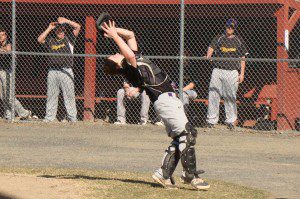 Westfield Voc-Tech catcher Chris Boyden settles under a pop fly for an out. (Photo by Chris Putz)