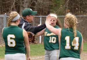 Southwick coach Todd Downie high fives his softball players during a 2015 regular season softball game. Downie was allegedly fired for assault, sources say. (Photo by Chris Putz)