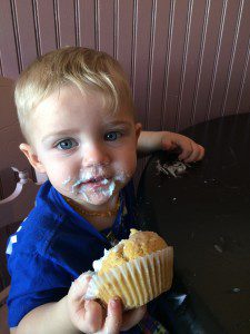 Wyatt Steglinski enjoys a blue frosted cupcake for Autism Awareness Day yesterday at Mama Cakes. (Photo by Hope E. Tremblay) 