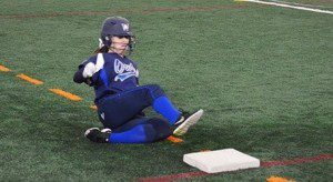 Breanne Bisceglia slides into third base.