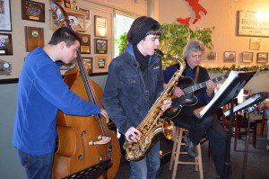 Master jazz guitarist Jay Messer, on right, orchestrates a Youth Jazz Connection at E.B’s Restaurant in Agawam, featuring local young people. Pictured with Messer are Gus Köhlin and Gavin Kelso on Thursday night. (Photo by Lori Szepelak) 