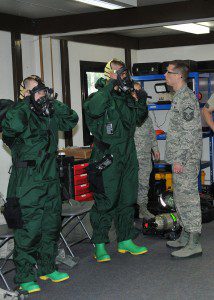 Master Sgt. Christopher McCrary, Emergency Management Flight non-commissioned officer in charge, Barnes Air National Guard Base, , inspects Airman 1st Class Neal Colburn and active-duty Staff Sgt. John Gaylord in their Personal Protection Level-B suits during an exercise May 6 at Spangdahlem Air Base, Germany. The Guard and active-duty Airmen are training together on Active CBRNE (Chemical Biological Radiological Nuclear and High- Yield Explosives) Response to enhance their Hazmat Technician Certification. This is a required training that needs to be done by the guard and the active duty. Doing the training together allows them to increase their knowledge by sharing their experiences and use different types of equipment. (U.S. Air National Guard photo by Tech. Sgt. Melanie J. Casineau/Released)