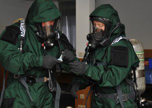 Technical Sgt. Nicole Locke, 104th Emergency Management Flight, Barnes Air National Guard Base, and active-duty Master Sgt. Tony Malbrough, sample an unknown substance for testing during an exercise May 6 at Spangdahlem Air Base, Germany. Locke is training on Active CBRNE (Chemical Biological Radiological Nuclear and High- Yield Explosives) Response with the active-duty members to enhance their Hazmat Technician Certification. . This is a required training that needs to be done by the guard and the active duty. Doing the training together allows them to increase their knowledge by sharing their experiences and use different types of equipment. (U.S. Air National Guard photo by 2nd Lt. Bonnie Harper/Released)