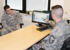 Senior Master Sgt. Nicholas Kollett, Enlisted Force Development Manager, Joint Force Headquarters, Massachusetts Air National Guard, Hanscom, Air Force Base, Mass., trains an active-duty member , on the Virtual Personnel  Center (vPC) program, Ramstein Air Force Base, Germany, May 7, 2015. The active duty is currently using the Evaluation Management System (EMS) that is being phased out, requiring them to transition to vPC by September of  this year. (U.S Air Force photo by Tech. Sgt. Melanie J. Casineau/Released)