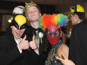 Zachary Jarvis, Sean Murphy and Sara Chlastawa, mug for the camera as they prepare to have their picture taken Saturday evening at the WHS prom. (Photo by Carl E. Hartdegen)