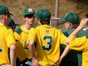 Players for the St. Mary High School varsity baseball team listen to instructions from head coach Troy Collins, right, Monday at Palmer's Legion Field. (Photo by Chris Putz)