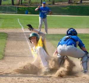 Colin Blake beats the tag at home plate against Palmer Monday for the first run of the game in the third inning. (Photo by Chris Putz)