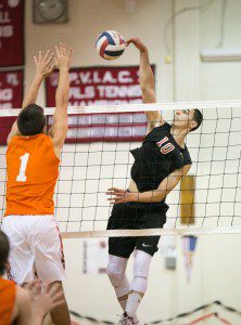 Westfield's Manny Golob , right, spikes the ball during a regular season match against Agawam. The Brownies, Chicopee Comp Colts, West Springfield Terriers and others stand in the path a Bombers' sectional title. (Photo by: Liam Sheehan)