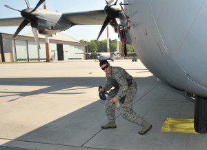 The non-commissioned officer in charge of equipment, 104th Explosive Ordnance Flight (EOD), 104th Fighter Wing, Barnes Air National Guard Base, Westfield, walks around the C-130 aircraft prior to “safeing” it, May 13, Ramstein, Air Base Germany. He is an emergency responder who will be qualified on “safeing” the C-130 aircraft, making him more valuable to the 104th Fighter Wing and New England area. (U.S. Air National Guard photo by Tech. Sgt. Melanie J. Casineau/Released)