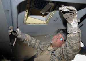 Staff Sgt. Robert Krider, 104th Explosive Ordnance Disposal Flight, removes flares from a C-130 aircraft May 13, Ramstein Air Base, Germany. This was part of an EOD exercise and fulfilled their yearly aircraft-training requirement. (U.S. Air National Guard photo by 2nd Lt. Bonnie Harper)