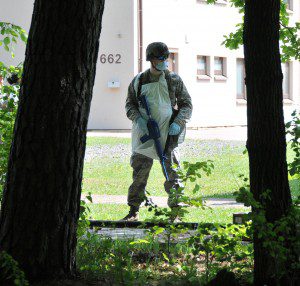 An Airman from the 104th Services Flight, Barnes Air National Guard Base,  waits to enter a wooded area for an expedient search and rescue training exercise, May 13, during Exercise Silver Flag, Ramstein Air Base, Germany. Silver Flag is a U.S. Air Force training course designed to educate airman with valuable skills allowing them to know how to deploy using real-world equipment in real-world scenarios. (U.S. Air National Guard photo by Tech. Sgt. Melanie J. Casineau/Released)