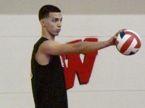 Manny Golob sizes up the competition before serving the ball up for Westfield. (Photo by Chris Putz)
