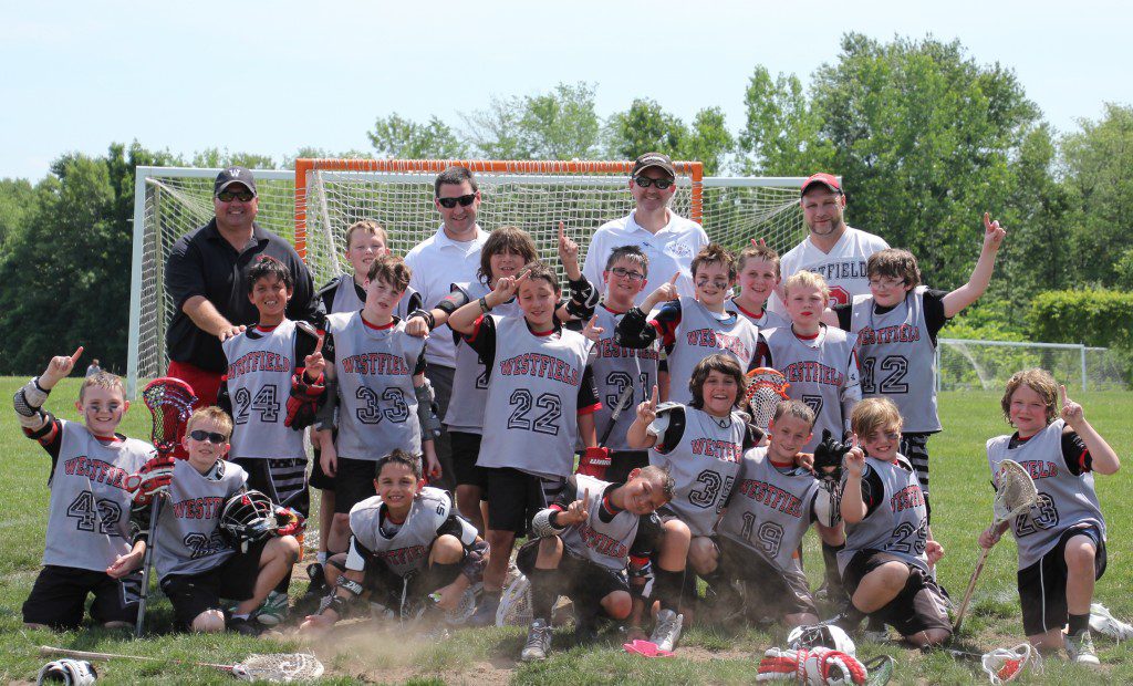 The Westfield Youth Lacrosse 4th Grade Bantam Team gathers out in front of the goal to celebrate the completion of their goal, an undefeated season on June 14 in South Hadley. Pictured from left to right: (Bottom row) Cullen Lawry, Bryce Roberts, Arion Slingerland, Anthony Ross, Brandon Shuman, Bobby Crean, John Gonglik, Anthony Gustafson; (Middle Row) Ethan Towers, Brody Fitzgerald, Drew Glenzel, Cameron Gainley, Aaron Hooben, Joe Easton, JJ Fox, Conor Connally, Colin Kane, James Thibeault; and (Back Row) Coaches Steve Gonglik, Chris Shuman, Dan Lawry, and Marcus Kane. (Submitted photo)
