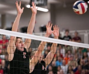 Eric Shilyuk (left) and Nick Hall (right) block the Needham hit yesterday in the Volleyball State Championship game at Babson College. (Photo by Liam Sheehan)