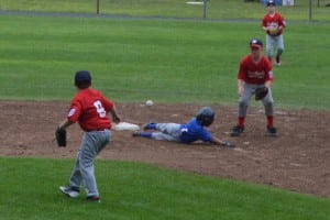 Eli Perez (blue) scored two runs in his first two at-bats and stole two bases, while also reaching on two singles and a double to help lead Westfield American's offense from his leadoff position.