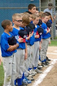 The Westfield Little League 7-9-Year-Old American All-Stars stand for the playing of the National Anthem Thursday night at Cross Street Field. (Photo by Chris Putz)