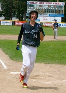 Cam Davignon (14) cracks a smile after crossing home plate for a Westfield run. (Photo by Chris Putz)